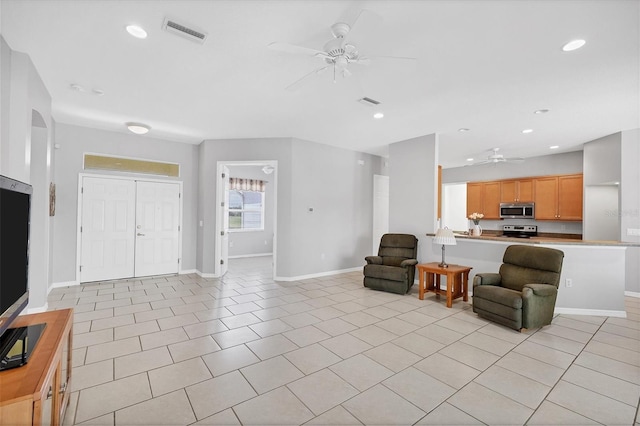 living room with light tile patterned floors and ceiling fan