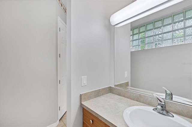 bathroom with tile patterned flooring and vanity