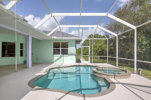 view of pool featuring an in ground hot tub, a patio, and a lanai