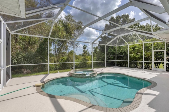 view of swimming pool with an in ground hot tub, glass enclosure, and a patio area