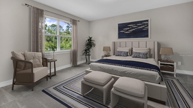 bedroom featuring carpet and baseboards