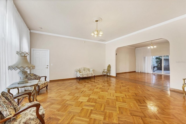 interior space featuring light parquet flooring, crown molding, and a notable chandelier