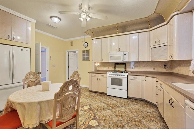 kitchen featuring ceiling fan, decorative backsplash, white appliances, ornamental molding, and a textured ceiling