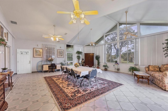 sunroom / solarium with lofted ceiling, ceiling fan, and a wealth of natural light