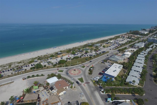 drone / aerial view featuring a water view and a beach view