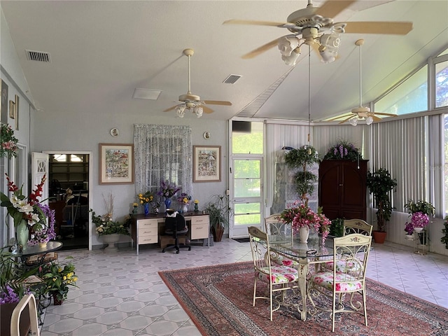 dining area with vaulted ceiling and a wealth of natural light