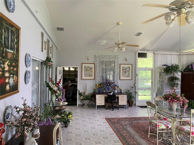 living room with ceiling fan and lofted ceiling