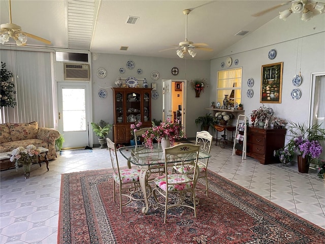 tiled dining room featuring lofted ceiling and an AC wall unit