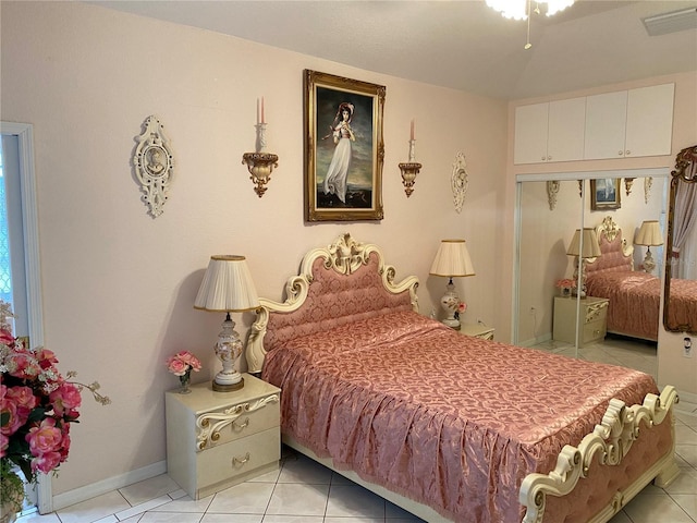 tiled bedroom featuring a closet