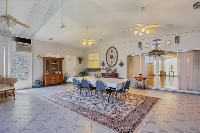 dining room with high vaulted ceiling, plenty of natural light, and a wall mounted air conditioner