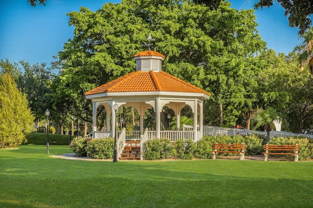 view of home's community with a yard and a gazebo