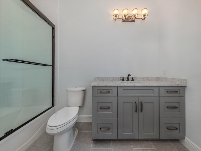 full bathroom featuring enclosed tub / shower combo, vanity, toilet, and tile floors