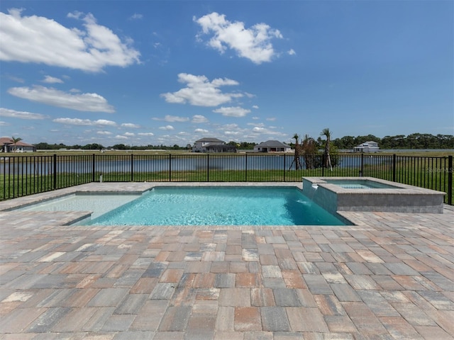 view of swimming pool featuring a patio and an in ground hot tub