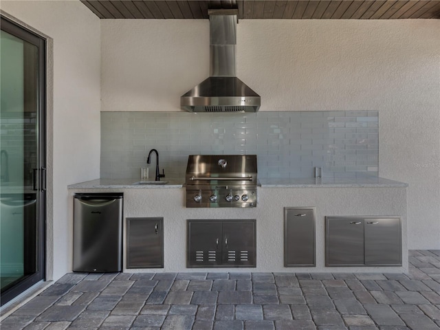 interior space featuring a grill, exterior kitchen, and sink