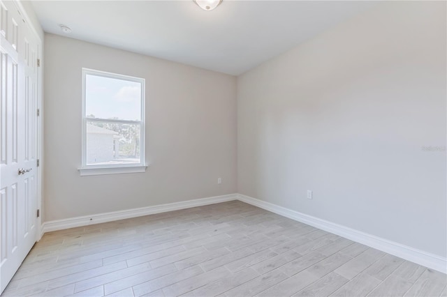 spare room with light hardwood / wood-style flooring