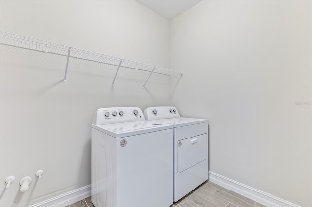 laundry room featuring independent washer and dryer