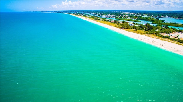 drone / aerial view with a beach view and a water view