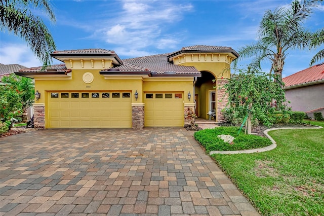 mediterranean / spanish-style home with a garage