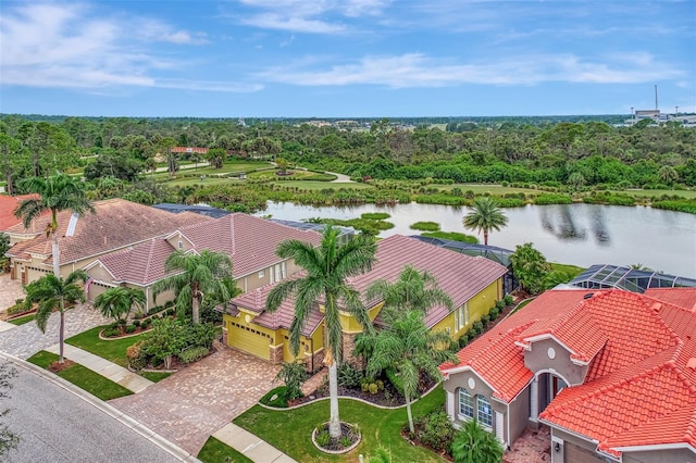 birds eye view of property with a water view