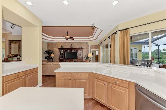 kitchen featuring dishwasher, ceiling fan, and light brown cabinets