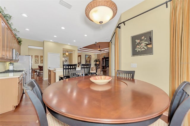 dining area featuring ceiling fan and light hardwood / wood-style flooring