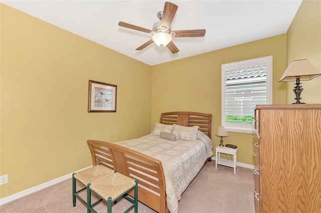 bedroom featuring ceiling fan and light carpet