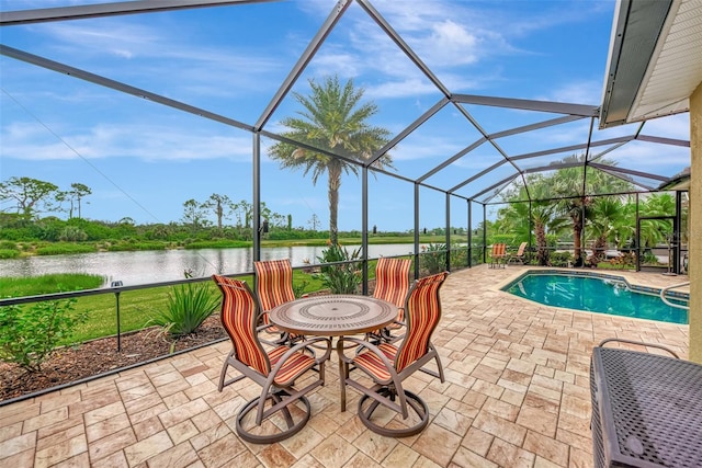 view of patio / terrace featuring glass enclosure and a water view