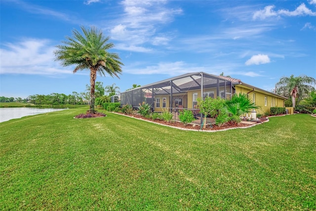 view of yard featuring a lanai and a water view