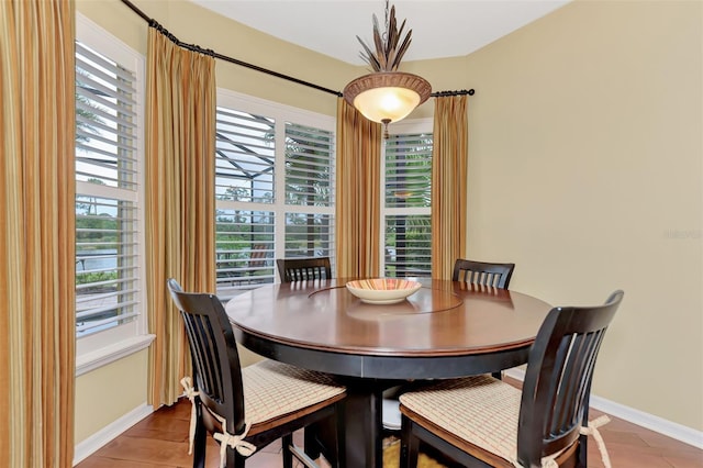 dining space featuring hardwood / wood-style floors