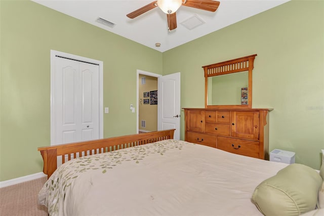 bedroom with ceiling fan, a closet, and carpet