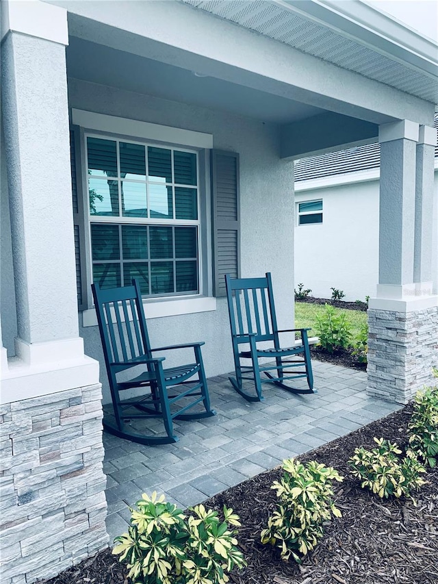 view of terrace featuring covered porch