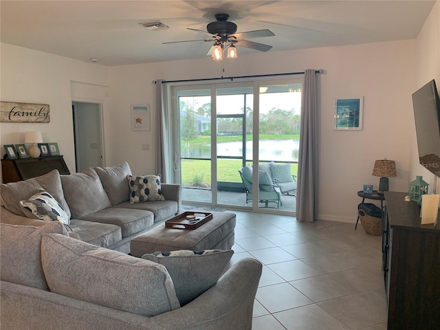 tiled living room featuring ceiling fan