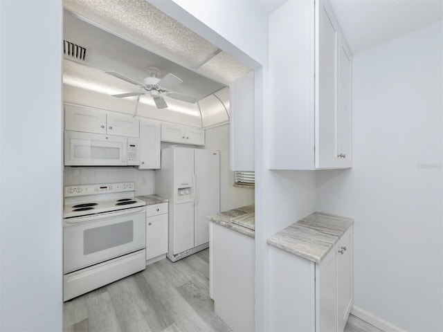 kitchen featuring light hardwood / wood-style floors, white appliances, white cabinets, and ceiling fan