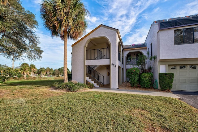 exterior space with a balcony and a front lawn