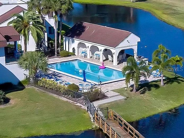 exterior space with a water view and a patio area