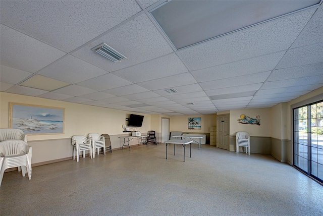 playroom featuring a paneled ceiling