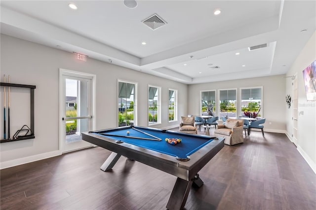 recreation room featuring a tray ceiling, pool table, and dark hardwood / wood-style flooring