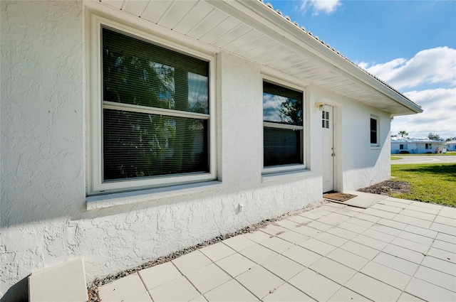 doorway to property featuring a patio area