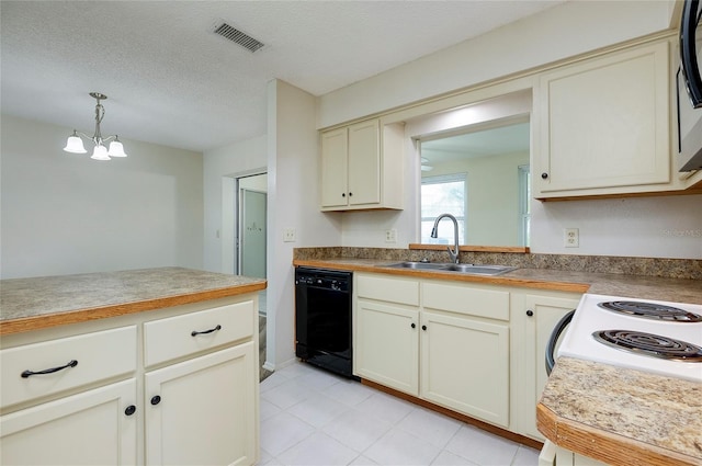 kitchen featuring dishwasher, hanging light fixtures, sink, cream cabinets, and a textured ceiling