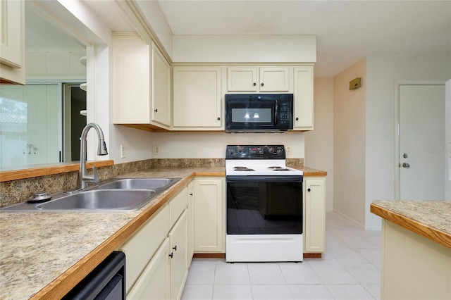 kitchen featuring a textured ceiling, black appliances, sink, cream cabinets, and light tile patterned floors