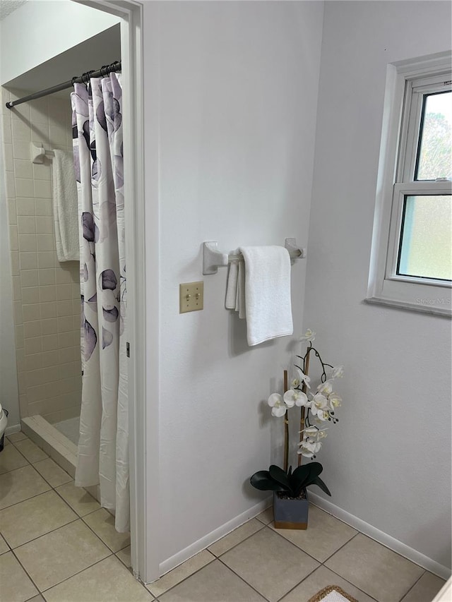 bathroom with tile patterned floors and a shower with shower curtain