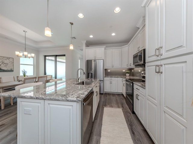 kitchen with dark hardwood / wood-style flooring, tasteful backsplash, white cabinetry, ornamental molding, and appliances with stainless steel finishes