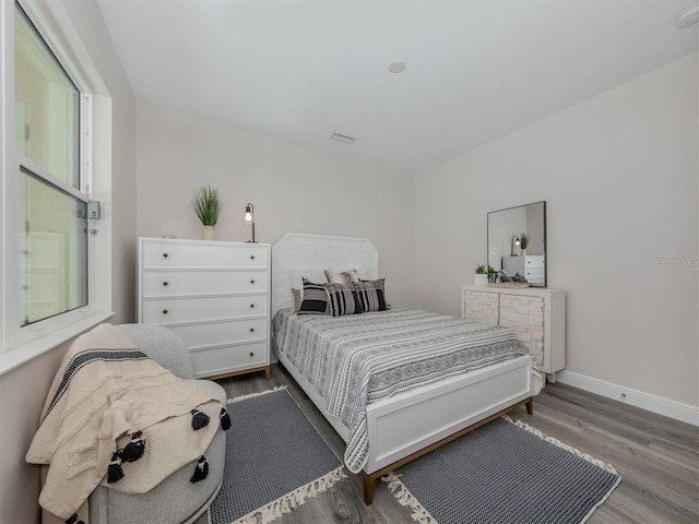 bedroom featuring wood-type flooring