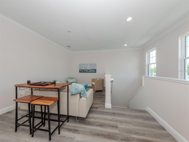 living room featuring ornamental molding and hardwood / wood-style floors