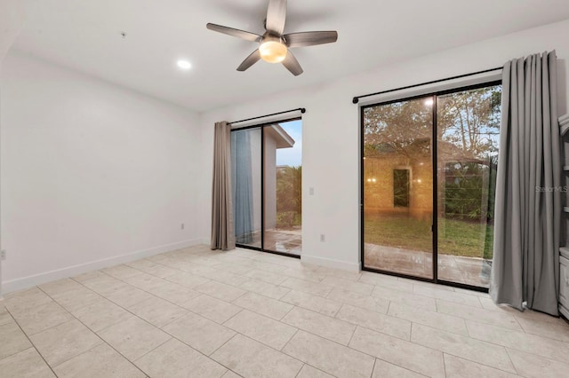 tiled empty room with ceiling fan