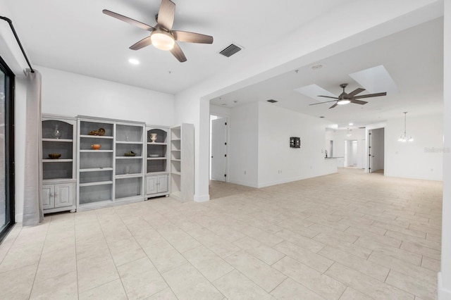 unfurnished living room with ceiling fan and light tile patterned floors