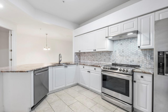 kitchen with light tile patterned flooring, kitchen peninsula, white cabinets, stainless steel appliances, and wall chimney exhaust hood