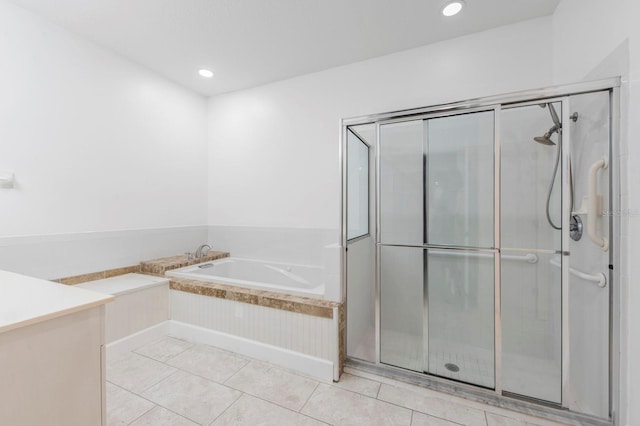 bathroom featuring independent shower and bath and tile patterned flooring