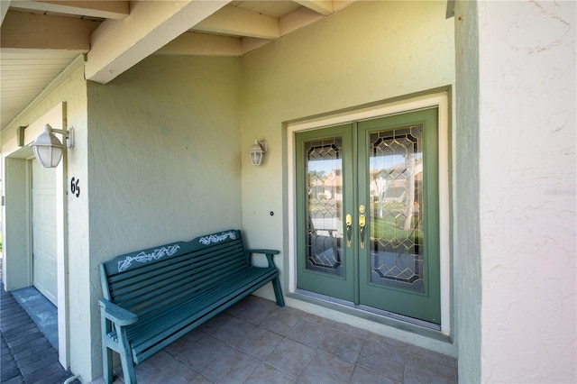 property entrance featuring french doors