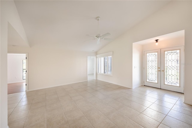 entryway with french doors, ceiling fan, light tile floors, and a wealth of natural light